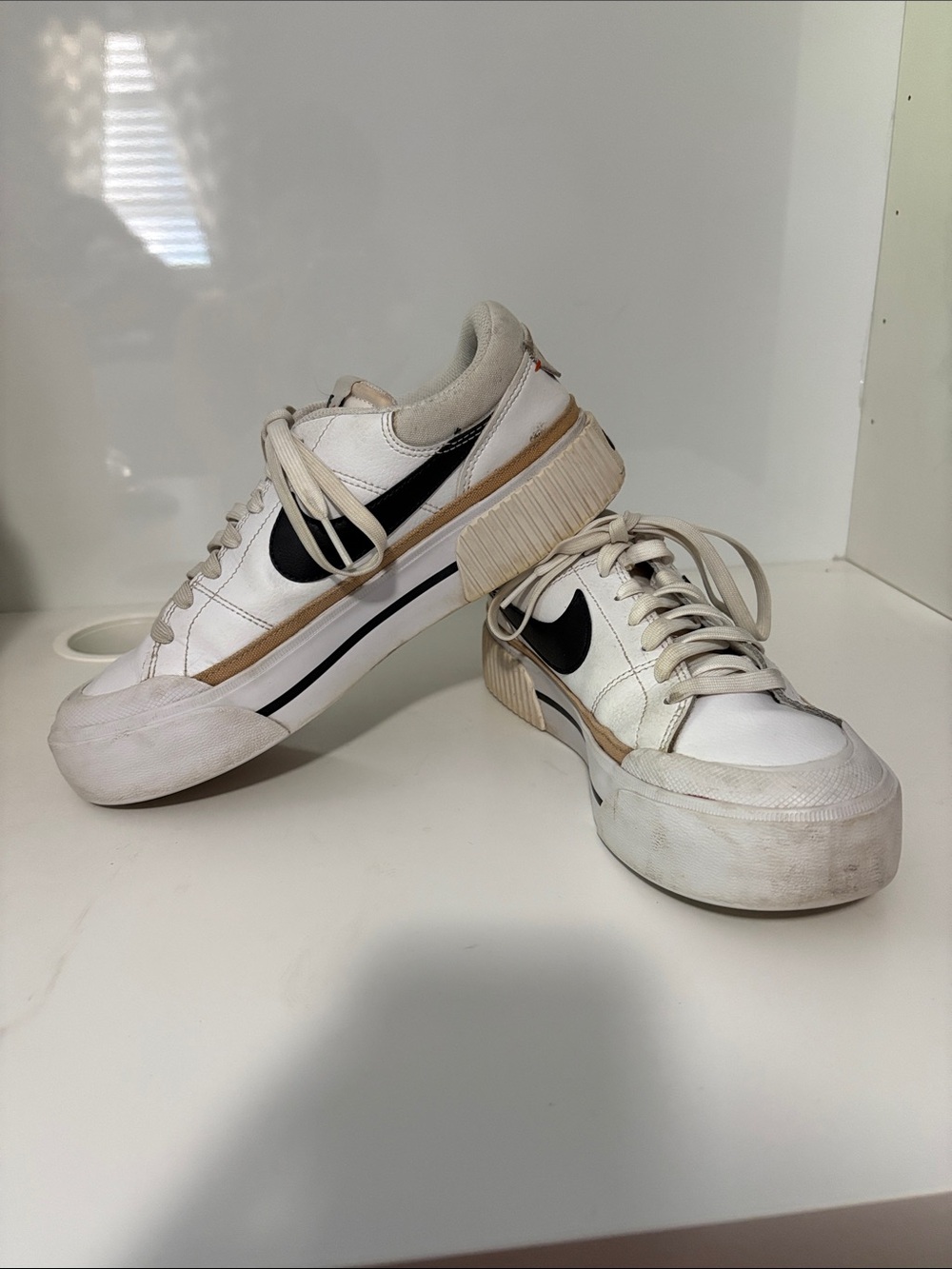 Nike Women’s White Sneakers with Black Swoosh and Tan Trim